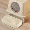 A white cat litter box ramp step with a removable filter tray is shown on a wooden floor.