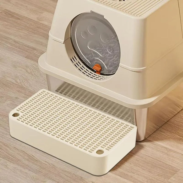 A white cat litter box ramp step with a removable filter tray is shown on a wooden floor.