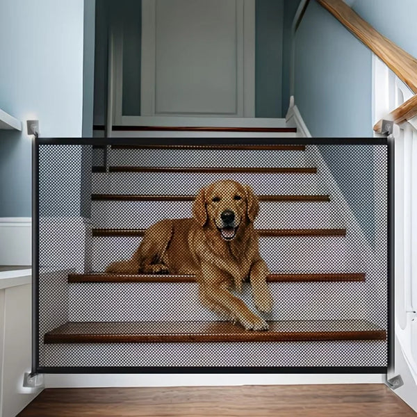 A heavy duty foldable pet gate with a wire mesh barrier installed on a wooden staircase.