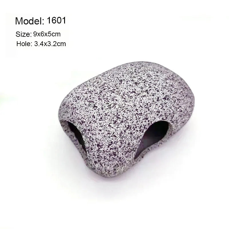 A smooth, gray ceramic cichlid cave aquarium decor piece with a natural filtration hole.