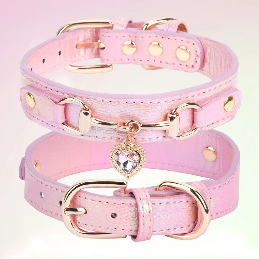 Pink leather dog collar with a gold-tone heart rhinestone charm