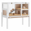 A white two-story wooden guinea pig cage with a stand, featuring wire mesh enclosures and bedding.