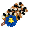 A mat for small animals featuring a colorful arrangement of pet foraging items in shades of brown, black, and cream.