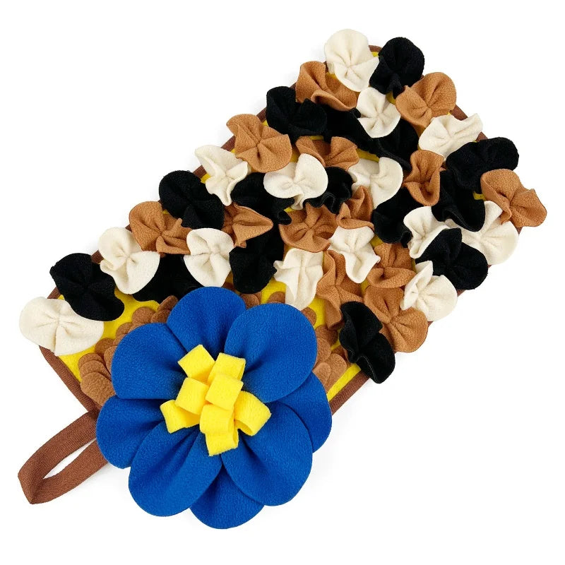A mat for small animals featuring a colorful arrangement of pet foraging items in shades of brown, black, and cream.