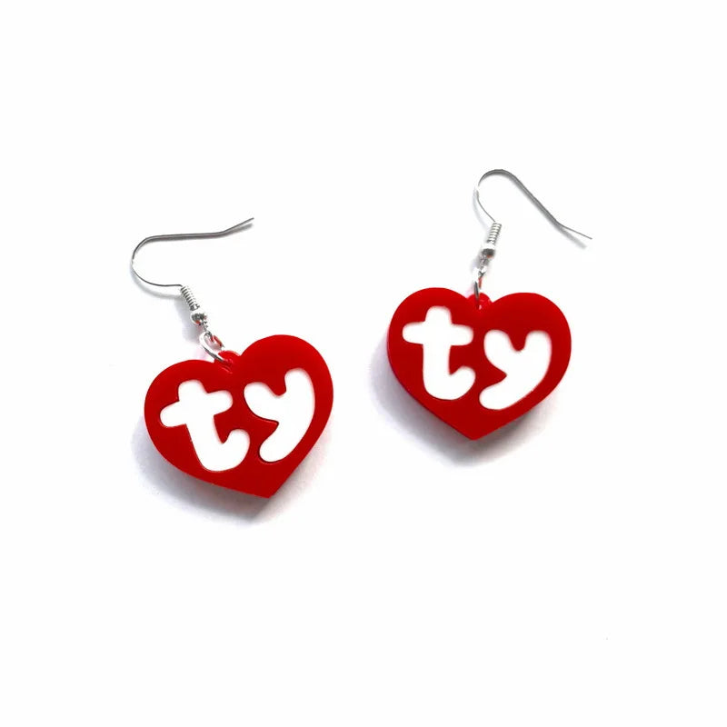 Pair of red acrylic heart drop earrings with the initials TY