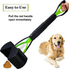 A portable foldable dog poop scooper with a black handle and green blade is shown next to a golden retriever.