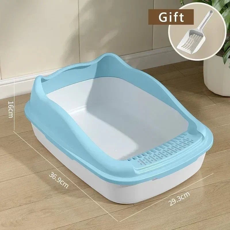 A light blue high-sided cat litter box with a white interior and anti-splash design shown on a wooden floor.