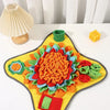 A colorful, textured snuffle mat for dogs featuring various fabric pieces in orange, green, red, and yellow.