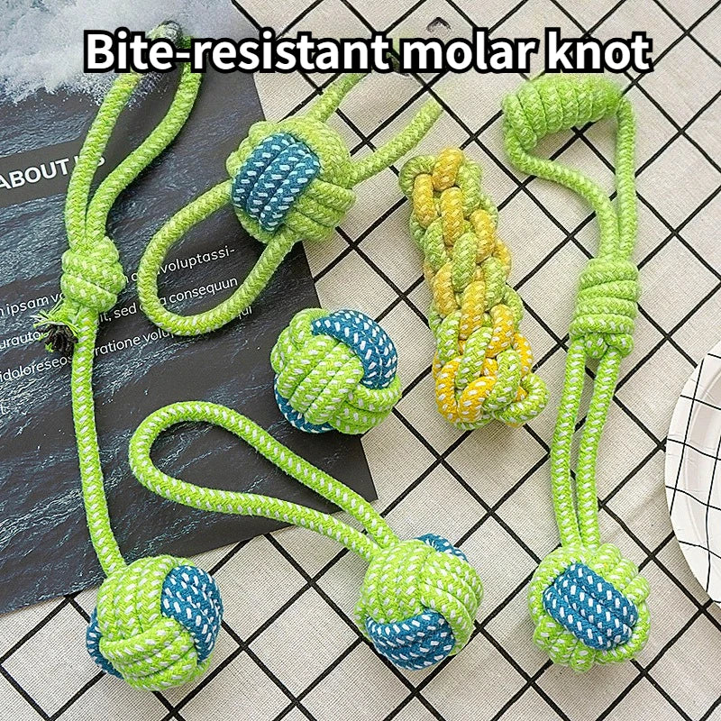 Several bite-resistant molar knots made of green and blue rope are displayed on a black surface.