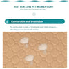 A close-up view of a beige, breathable mesh pet training mat with white, fluffy inserts.