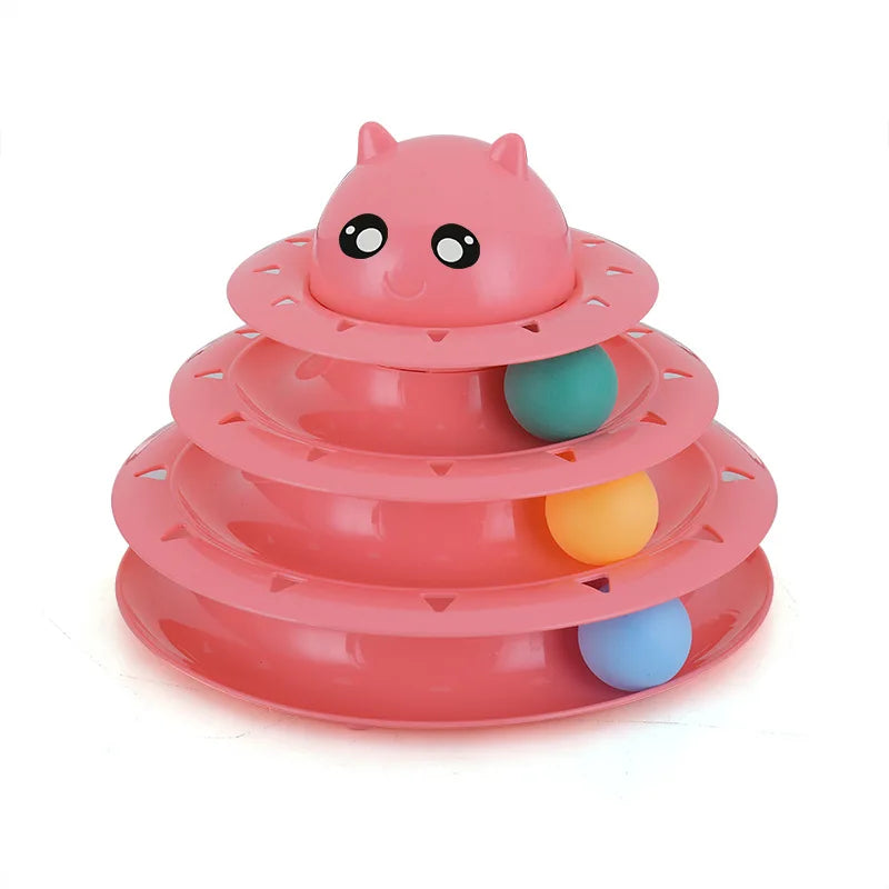 A pink 3-layer cat turntable toy featuring a face, balls, and a scratching board.