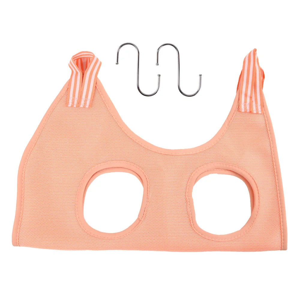 A pink pet nail trimming hammock for cats with a metal hanger.