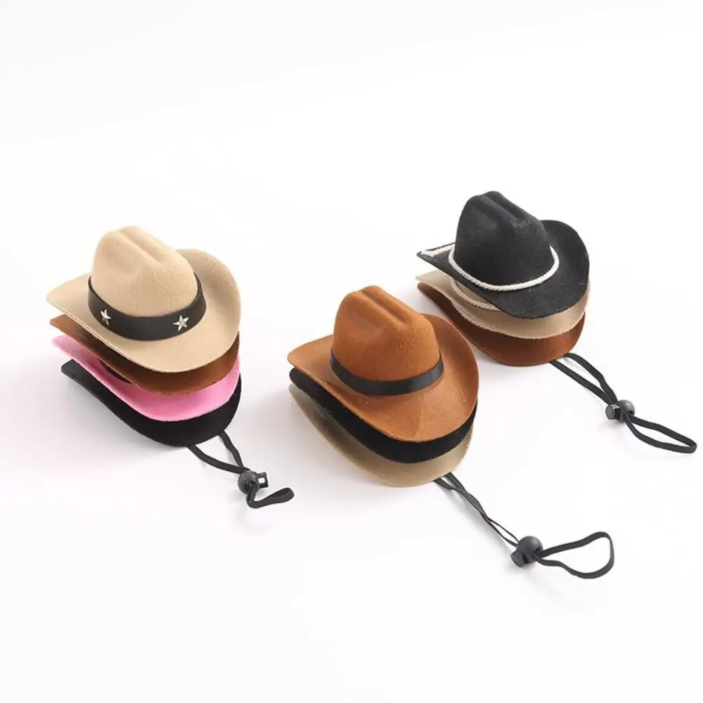 A set of three adjustable cowboy hats in tan, black, and pink for small dogs and cats