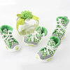 A set of four green and gray Teddy Bear soft sole shoes for small dogs with a lime green decorative cover.
