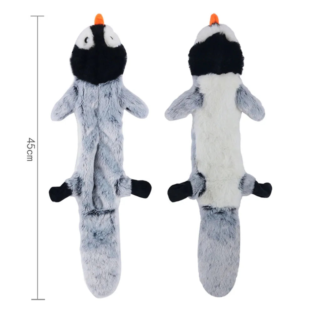 A pair of gray plush dog toys with black accents and orange noses, shown against a white background.