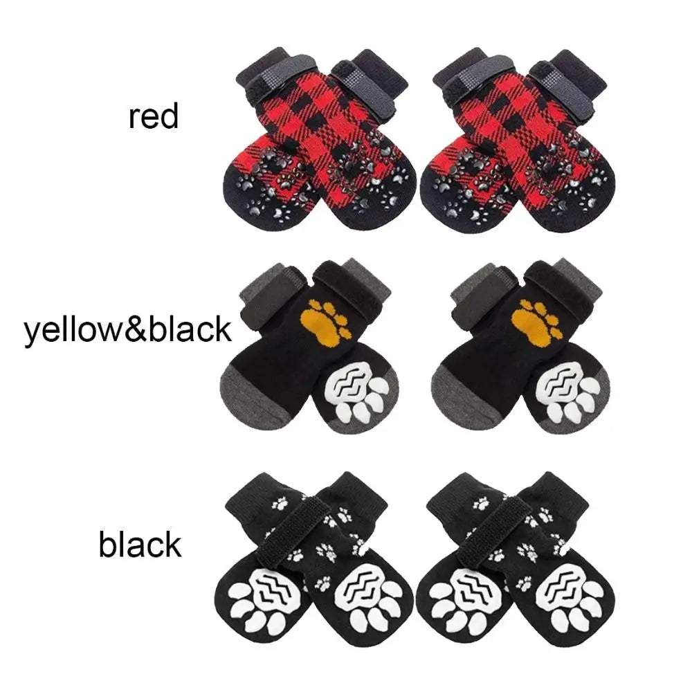 A set of breathable anti-slip dog socks in red, yellow and black, and black.