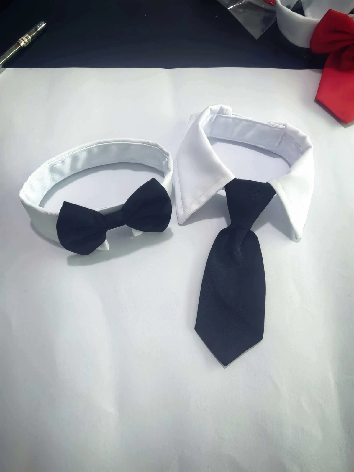 White adjustable formal bow tie collar for cats and small dogs with a black bowtie.