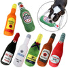A collection of various alcoholic beverages and a bottle-shaped squeaky plush dog toy.
