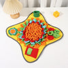 A colorful, textured snuffle mat for dogs featuring various fabric pieces and a puzzle element.