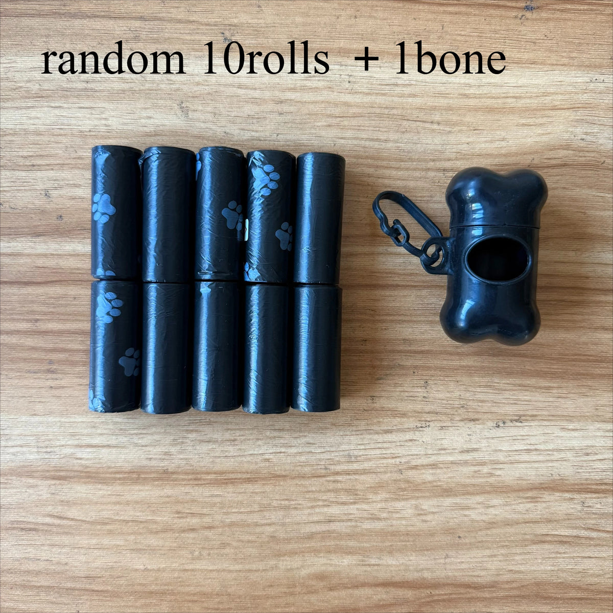 A set of ten black rolls and one bone for dog waste bags.