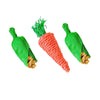 A handwoven natural vine bird and pet swing toy with bright green leaves and orange-red fibers.