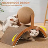 A cat is interacting with an arch bridge design cat scratcher featuring a rotating sisal ball.