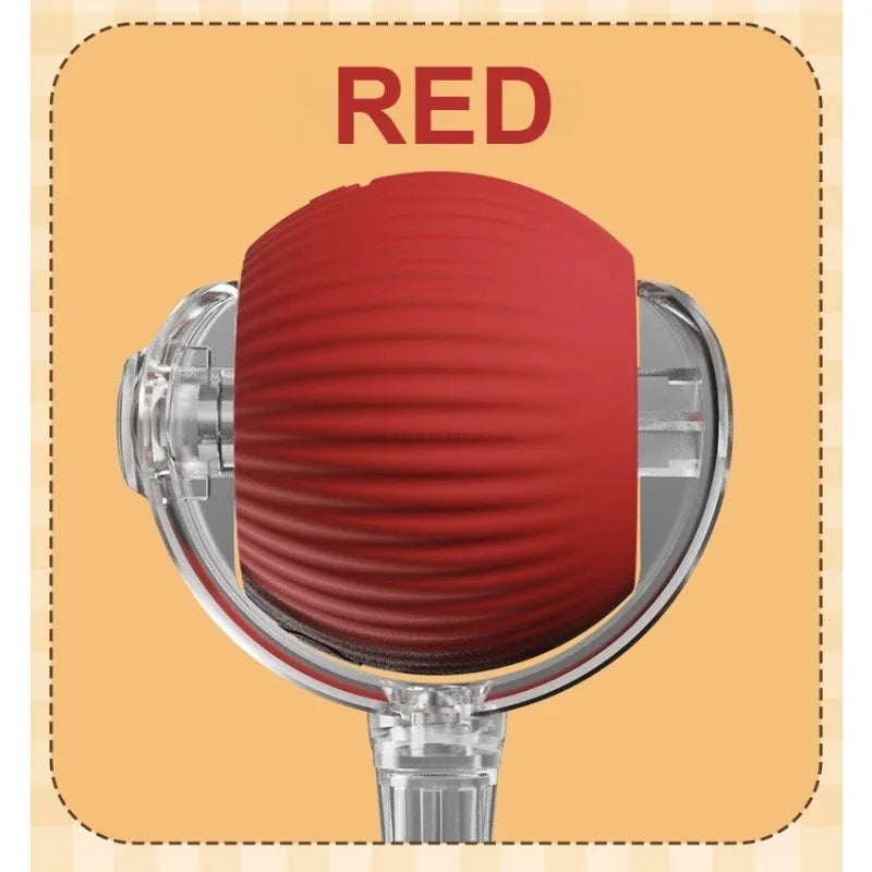 A red automatic rolling interactive ball for cats shown in a close-up view.