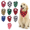 A collection of red, black, green, and plaid bandana scarves for dogs
