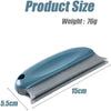 A light blue reusable pet hair remover brush with a handle and bristles, shown with dimensions 15cm and 5.5cm.