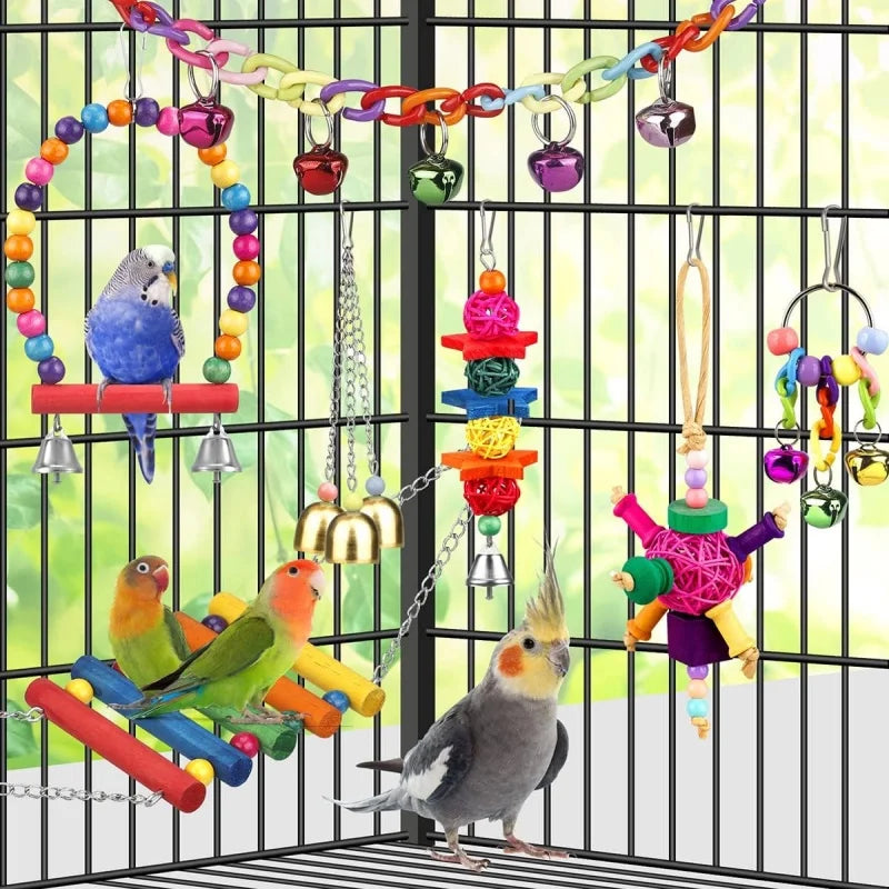 A parrot cage filled with natural wooden swing and chewing toys, including colorful chains and hanging elements.