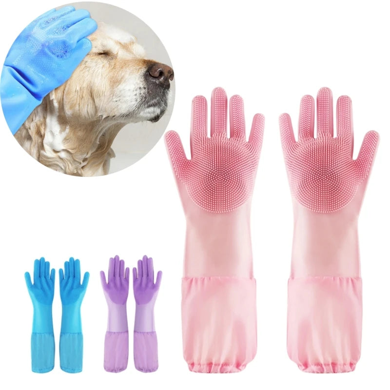 A set of pink pet grooming gloves for dogs and cats shown next to a dog's head.