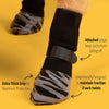 A close-up of non-slip dog socks with extra-thick grips and attached straps, demonstrating their traction features.