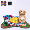 An interactive snuffle mat for dogs featuring colorful fabric pieces and a dog sitting on it.