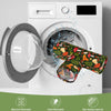 A white washing machine with a gray mesh laundry bag and a green fabric pet tunnel shown in use.