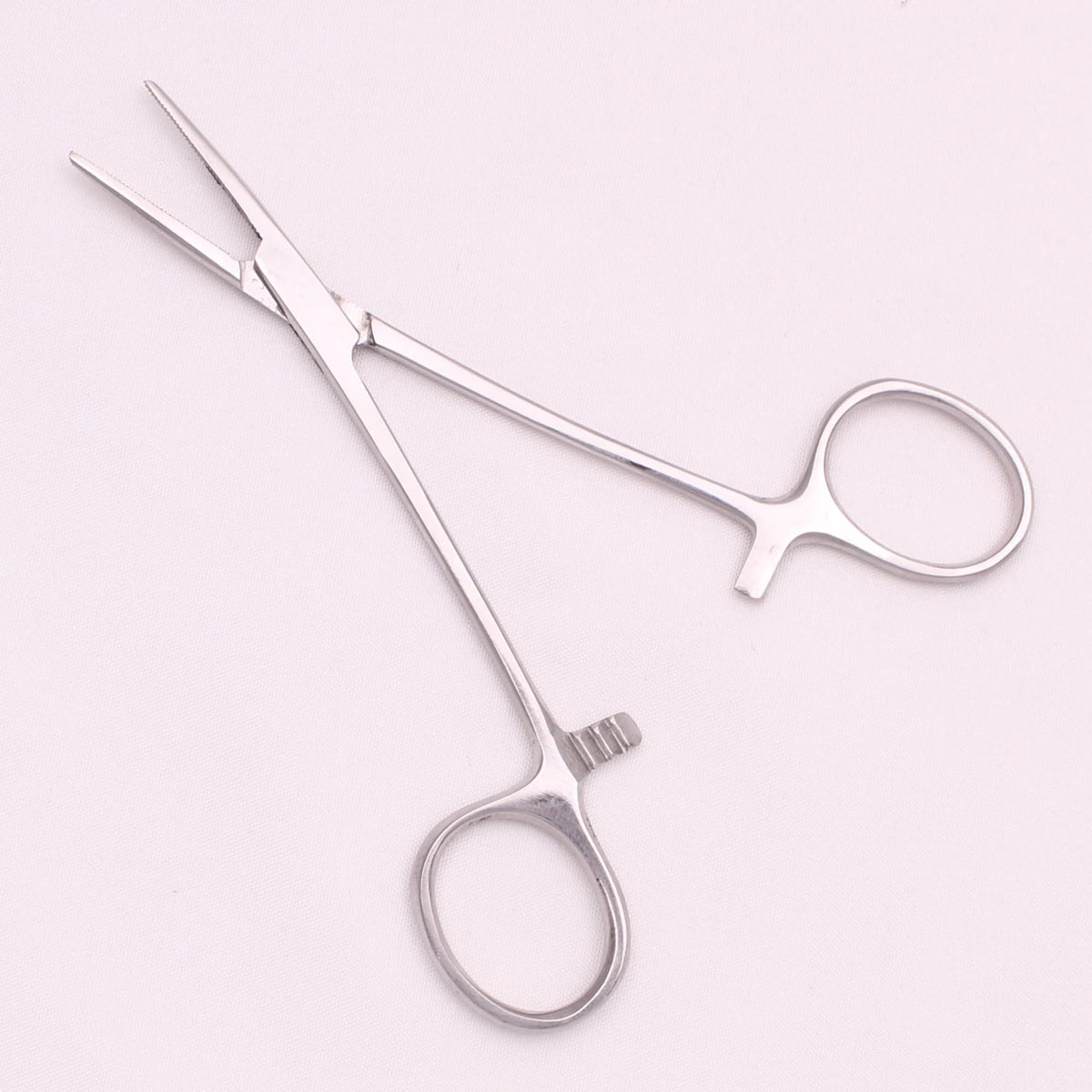A pair of professional stainless steel pet forceps used for minor injuries.