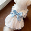 White breathable summer pet dress with light blue polka dots and a satin bow featuring a leash ring.