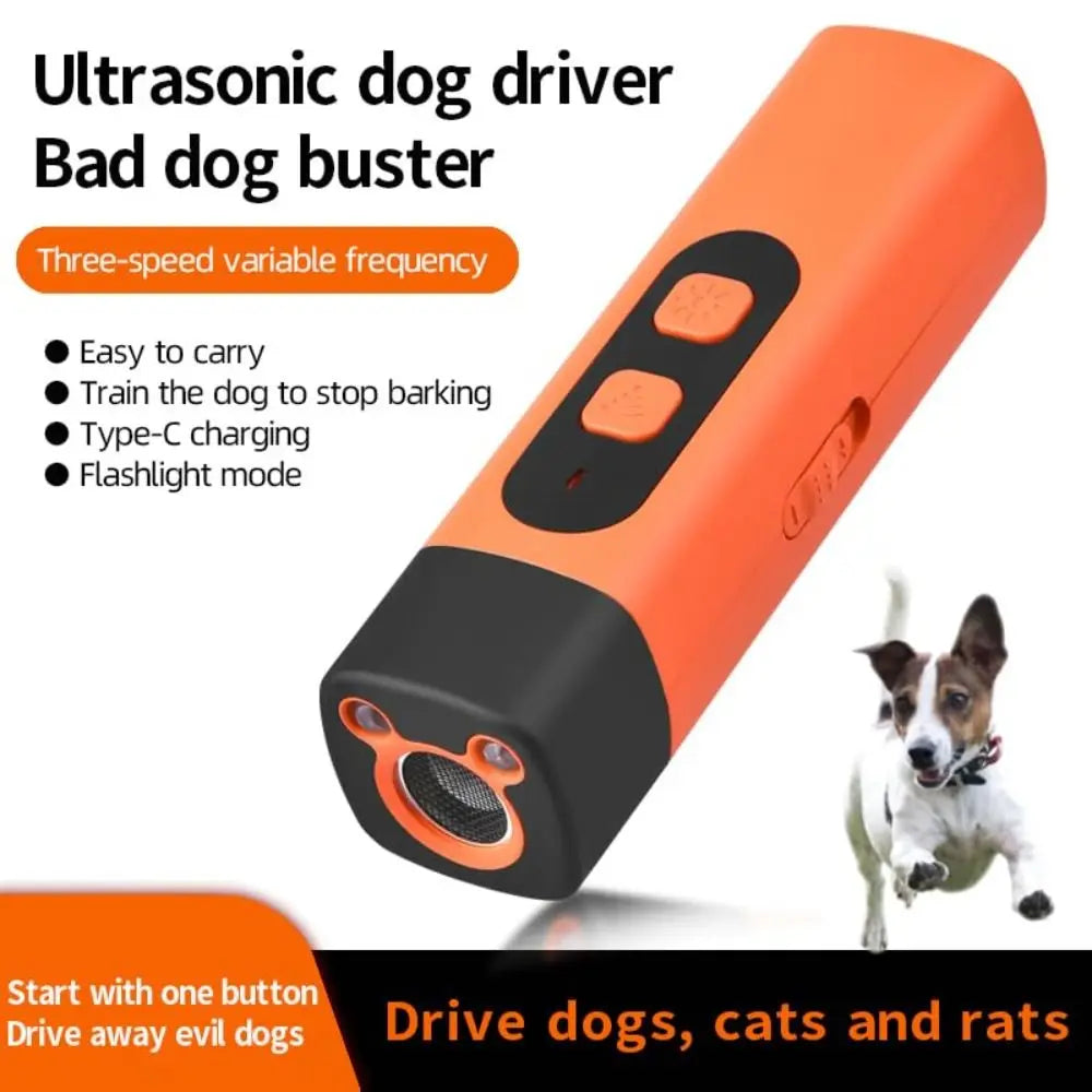Orange ultrasonic dog driver device with a black body and a small dog shown next to it.