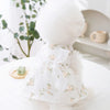 White tulle summer dog princess dress with bow and butterfly skirt displayed on a white surface