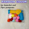 Klare Plastikverpackung mit gelbem Launcher und zwanzig bunter Pompons.