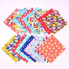 A colorful assortment of cotton triangle bandanas for dogs and cats in various patterns and colors.