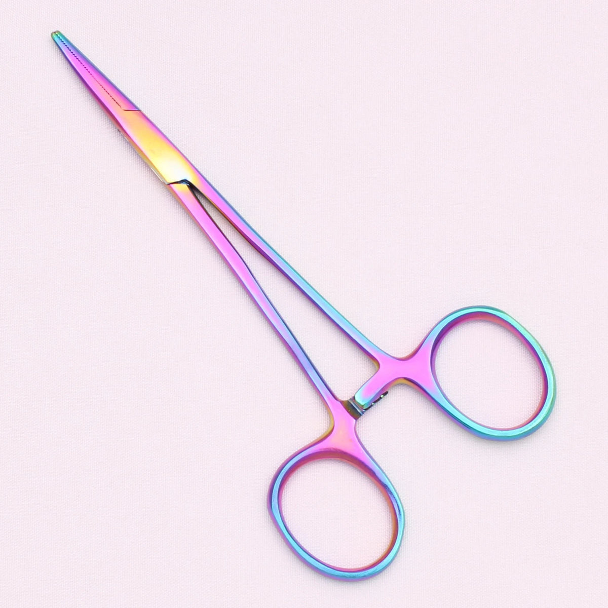 A pair of professional stainless steel pet forceps with iridescent pink and blue coloration.