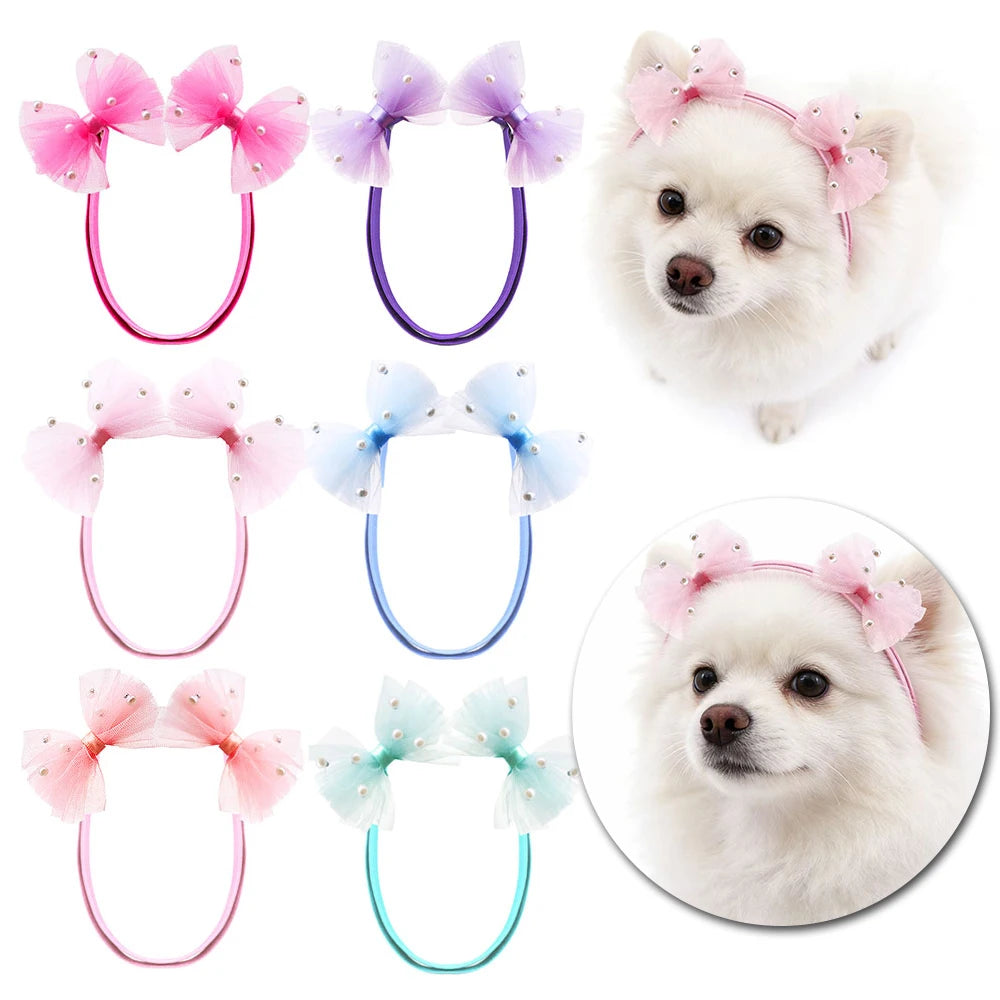 A collection of 30 handmade dog hair bow sets in various colors including pink purple blue and mint