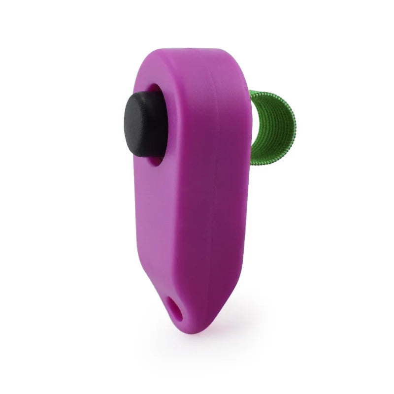 A purple pet training clicker with a black trigger and a green textured button.