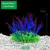 A cluster of vibrant purple and blue artificial aquarium plants growing in a shallow tray.