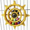 A yellow interactive parrot spinner rattle toy with a central mechanism and colorful balls.