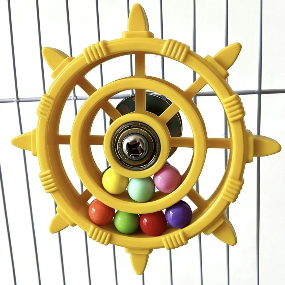 A yellow interactive parrot spinner rattle toy with a central mechanism and colorful balls.