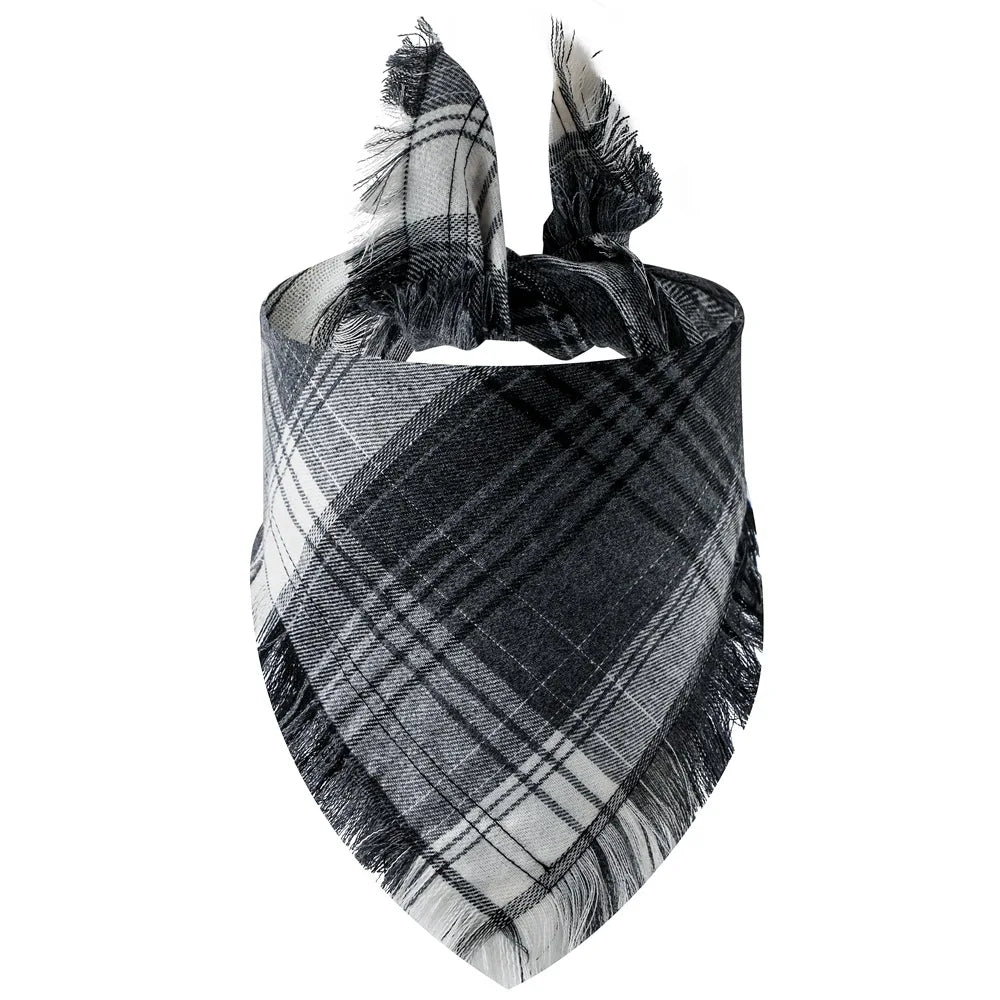 A plaid dog bandana with black and gray stripes and fringed edges.