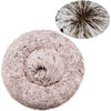 A round, fluffy pet bed for dogs and cats in a soft taupe color.