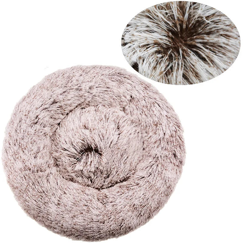 A round, fluffy pet bed for dogs and cats in a soft taupe color.