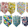 A collection of colorful cotton pet bandanas featuring various floral and patterned designs for dogs and cats.